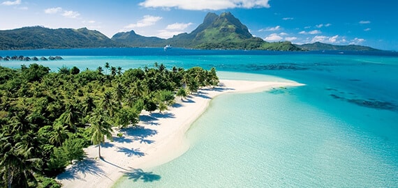 Secluded cove with palms and aqua water