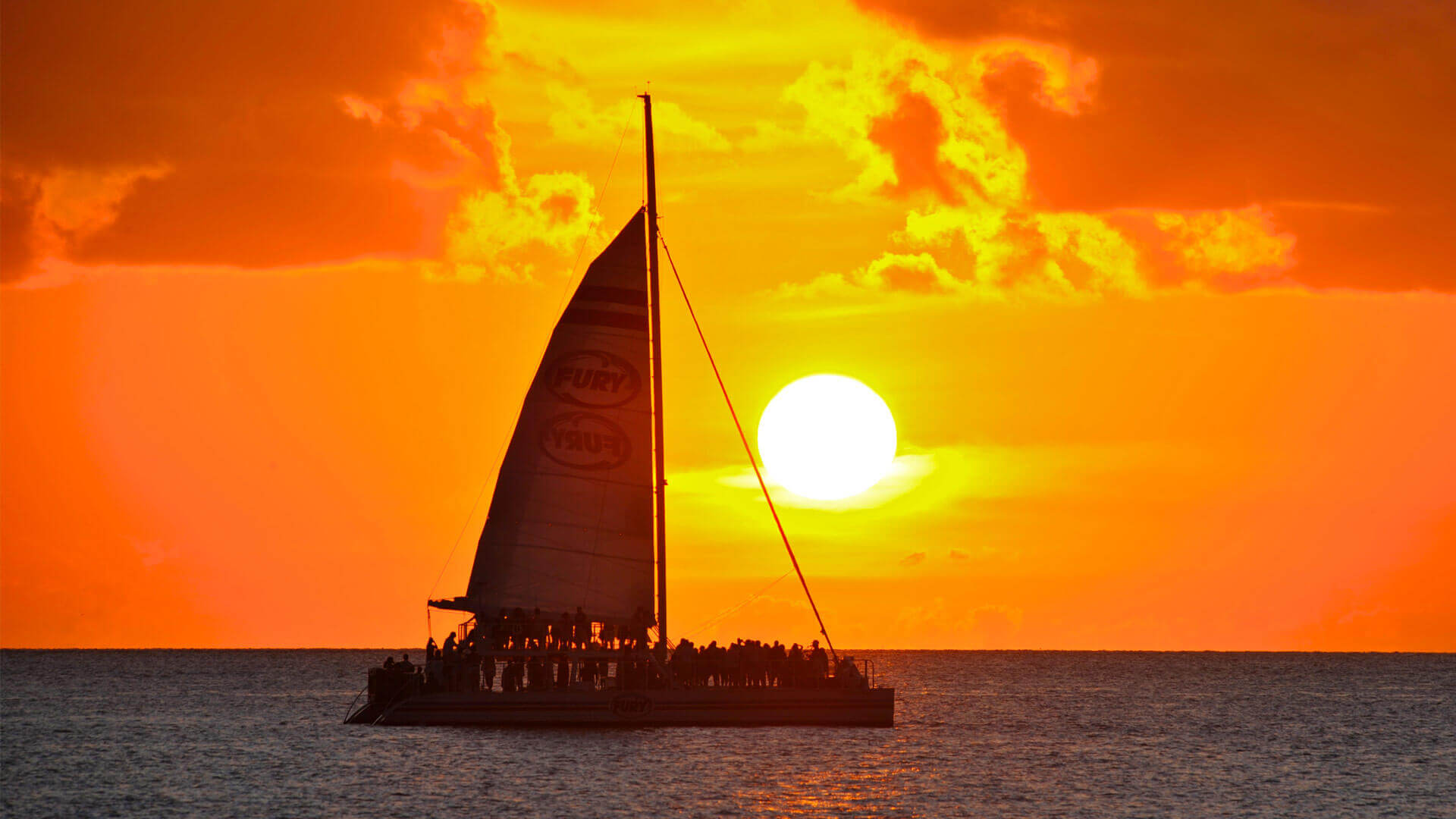 Cruise ship sailing at sunset